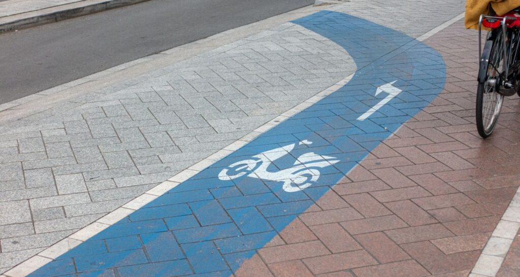 Separate lane of road in blue