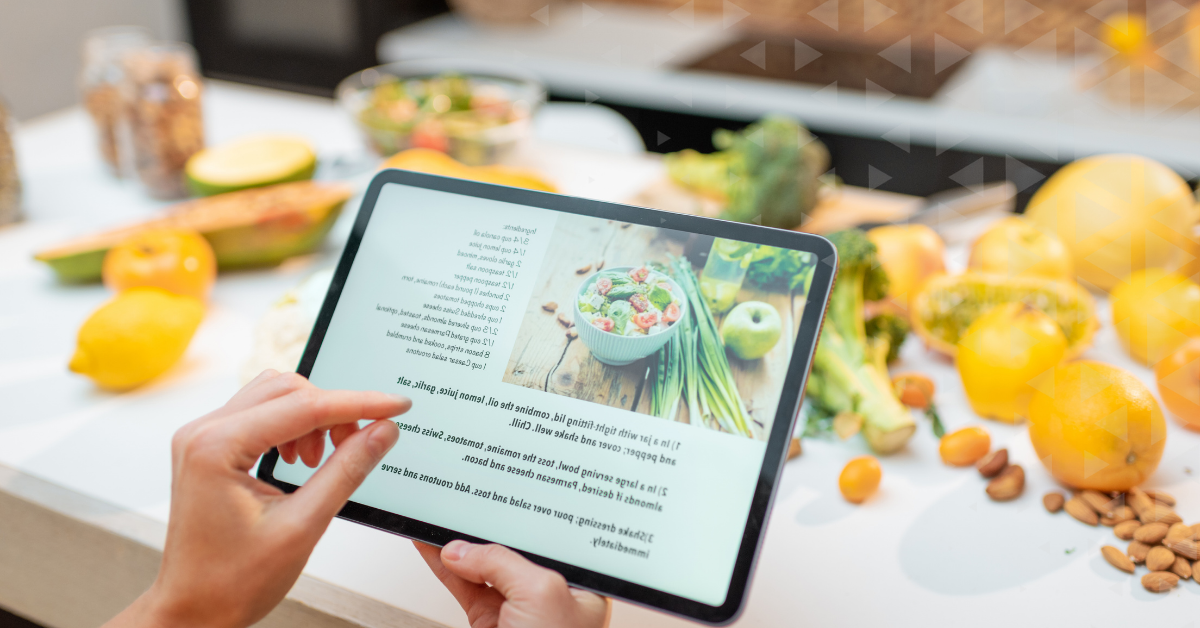 A person reading a recipe on a tablet