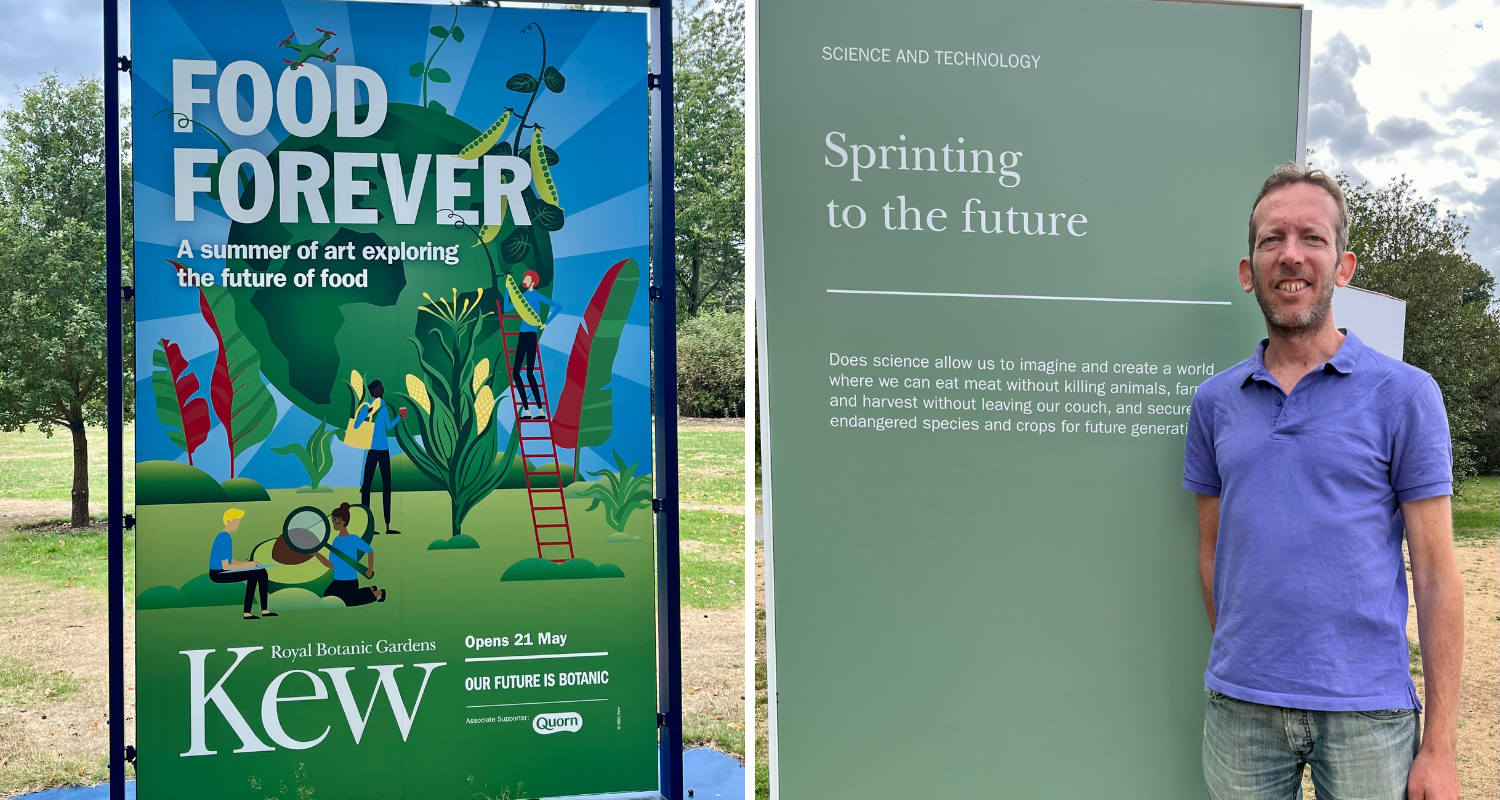 Food forever poster and a man standing next to it