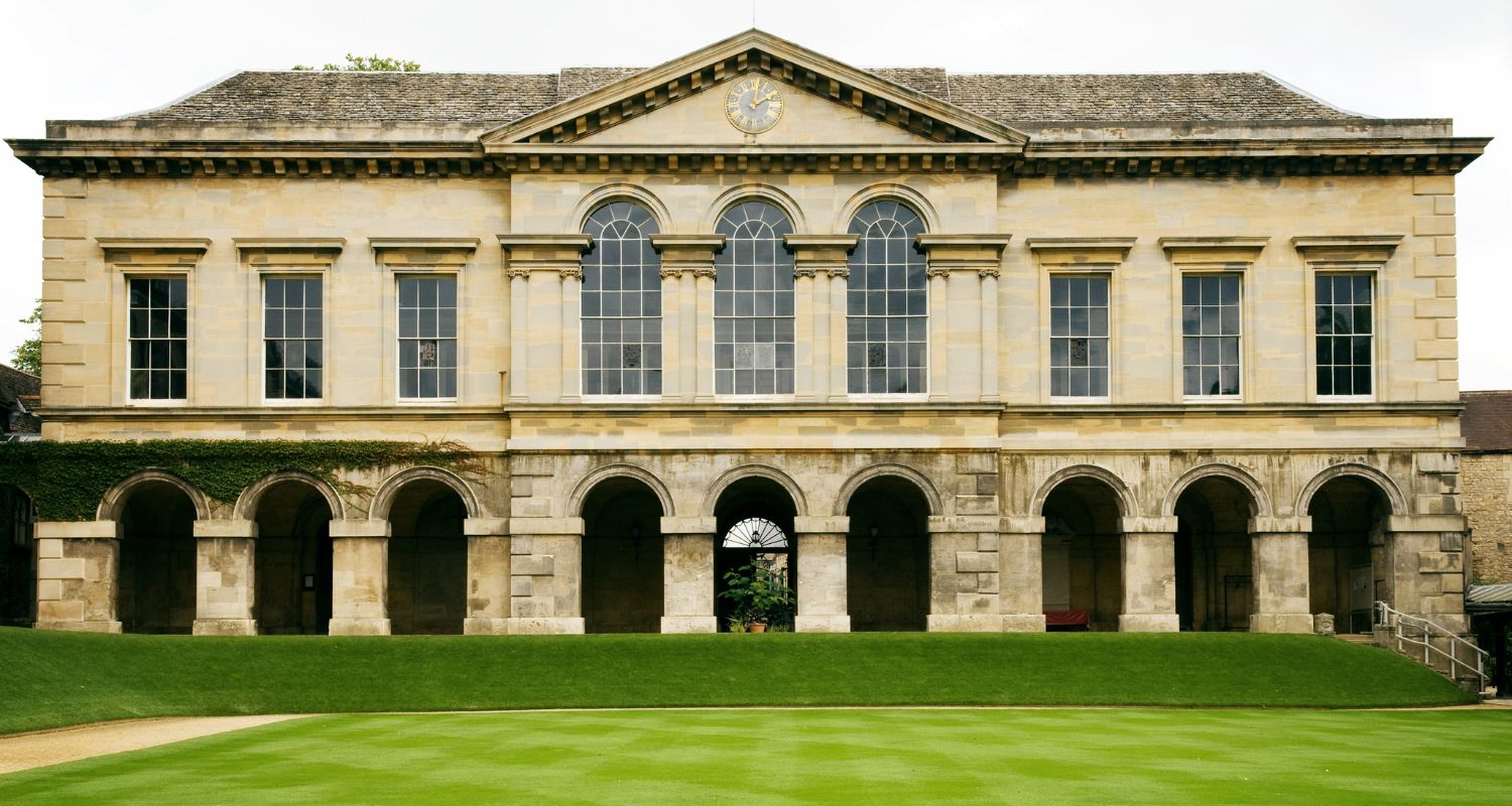 An old mansion with a manicured lawn