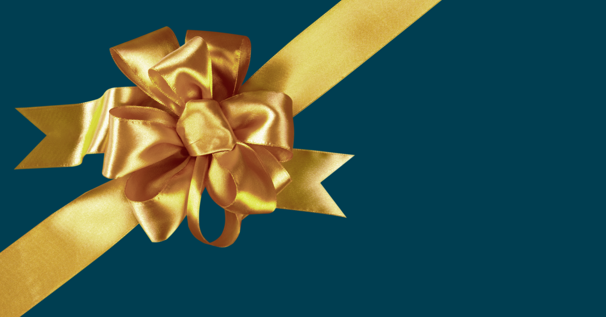 Golden bow on a navy blue background