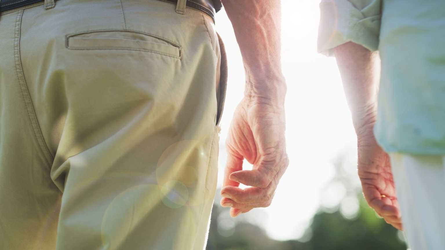 Close-up of the hands of two elderly people